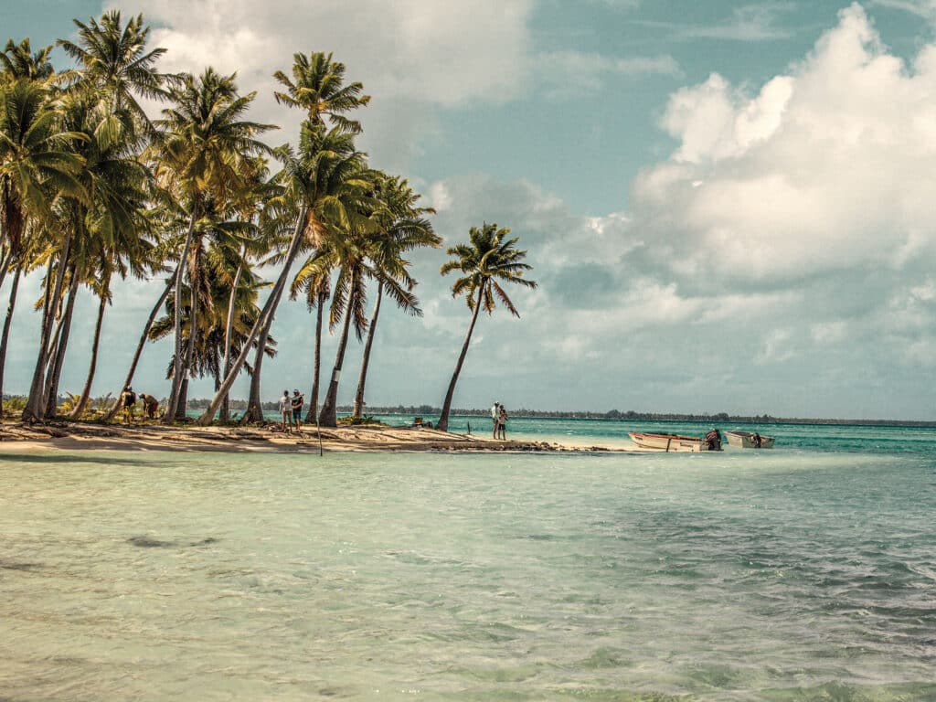 Secluded atoll with anglers