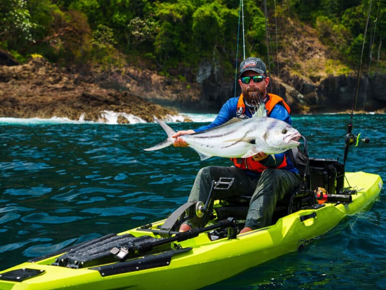 Kayak angler holding roosterfish in Panama