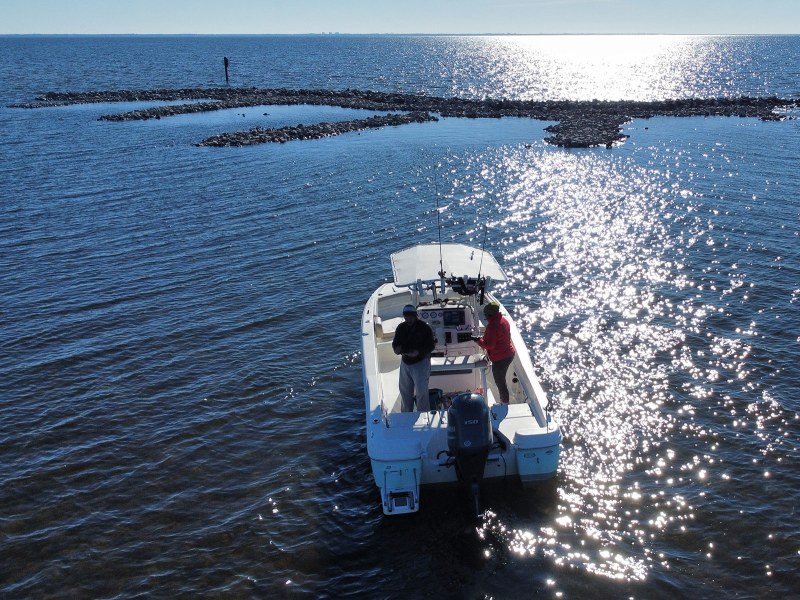 boat-fishing-oyster-reef fishing next to oyster reefs