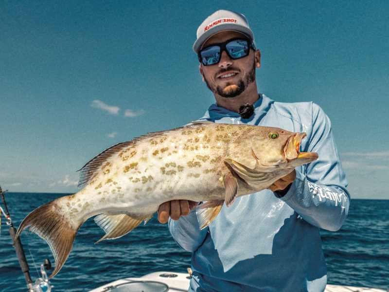 Angler with scamp grouper