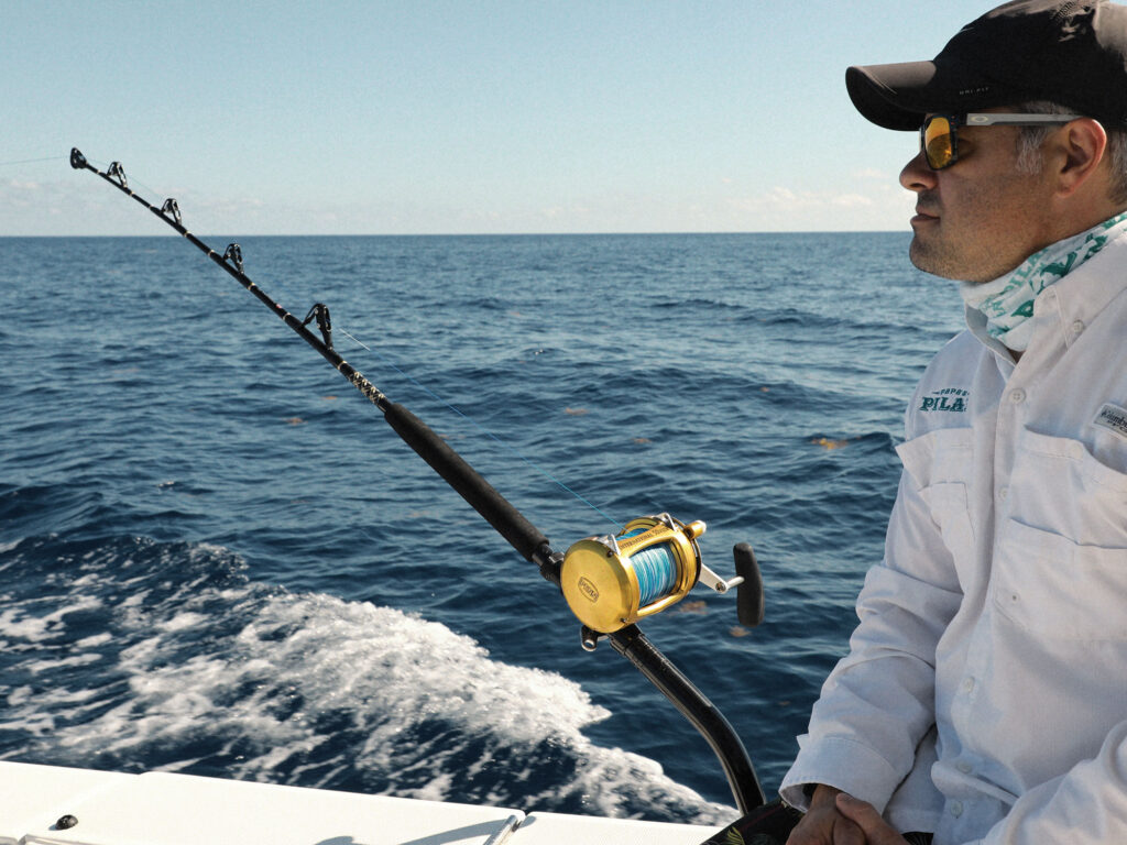 Angler fishing from a rod holder