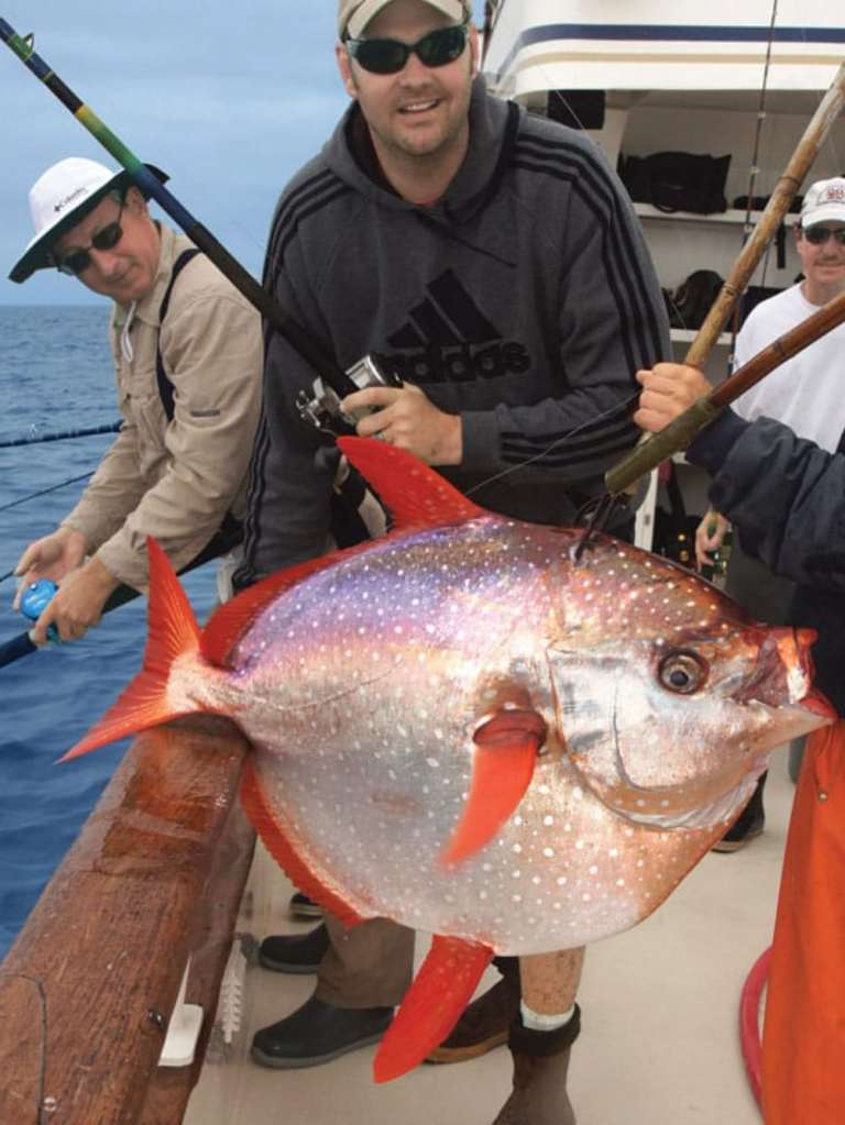 Fisherman with opah, or moonfish.