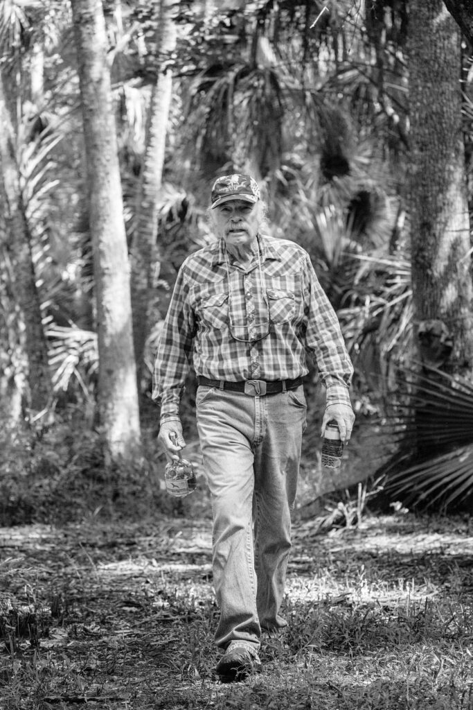 Flip Pallot walking through the woods