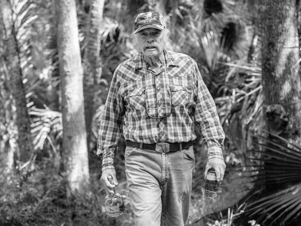 Flip Pallot walking through the woods