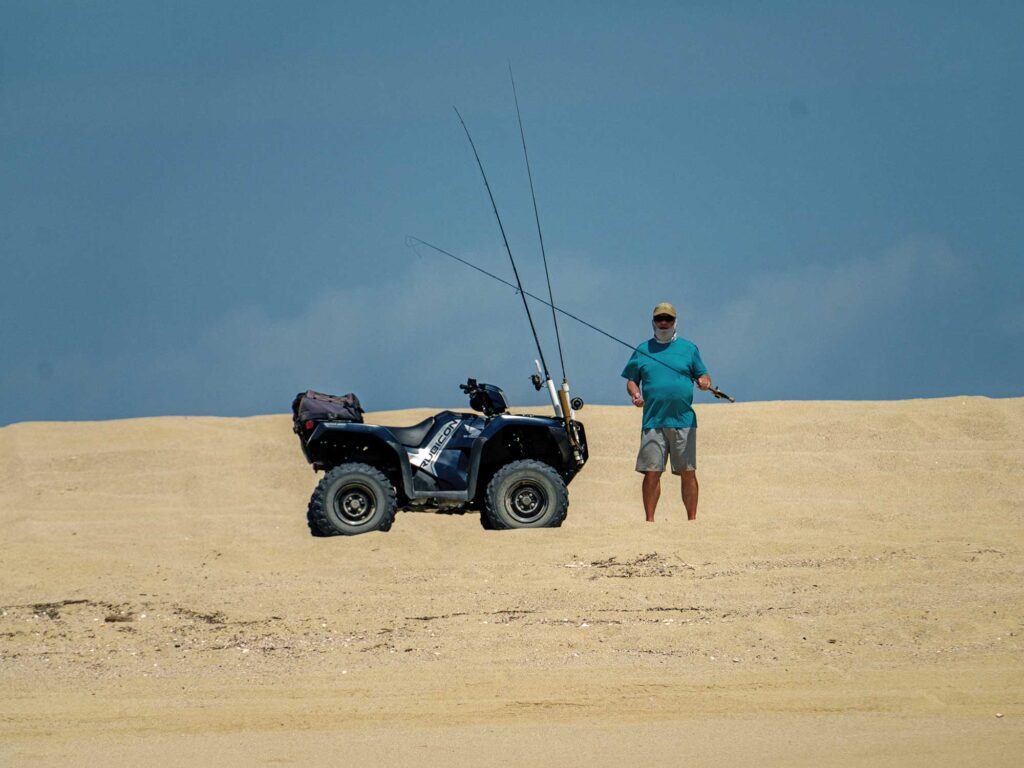 Riding a four-wheeler out to fish
