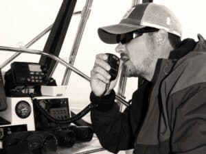 Angler using a VHF radio