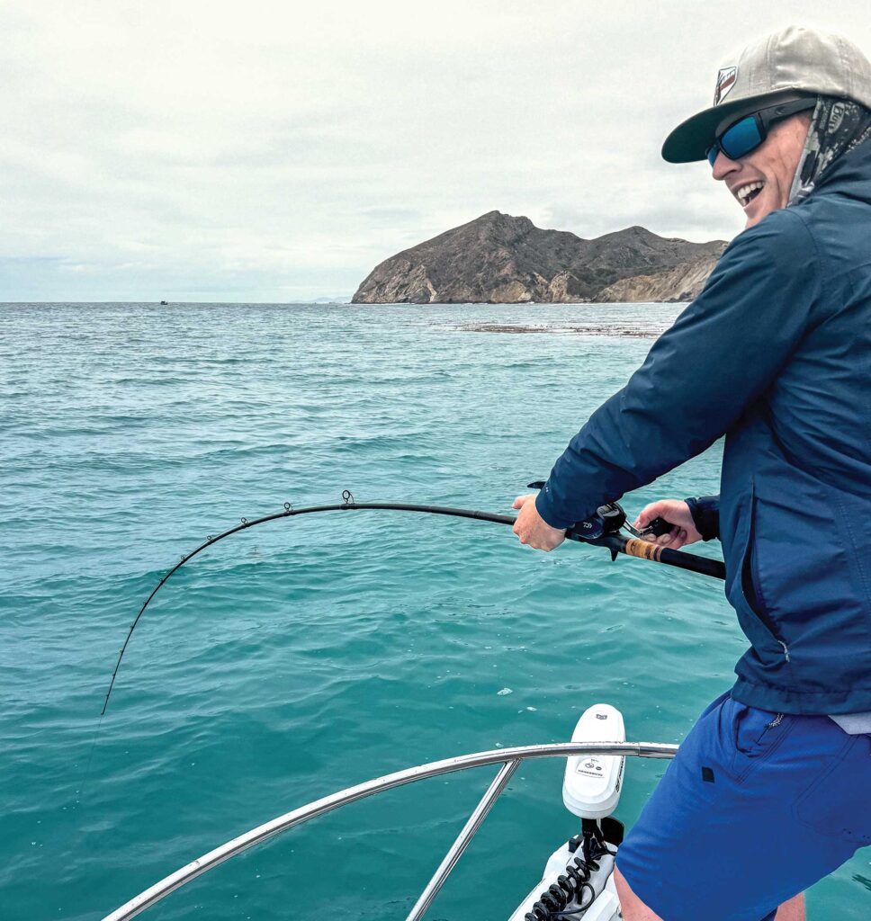 Angler battling white seabass