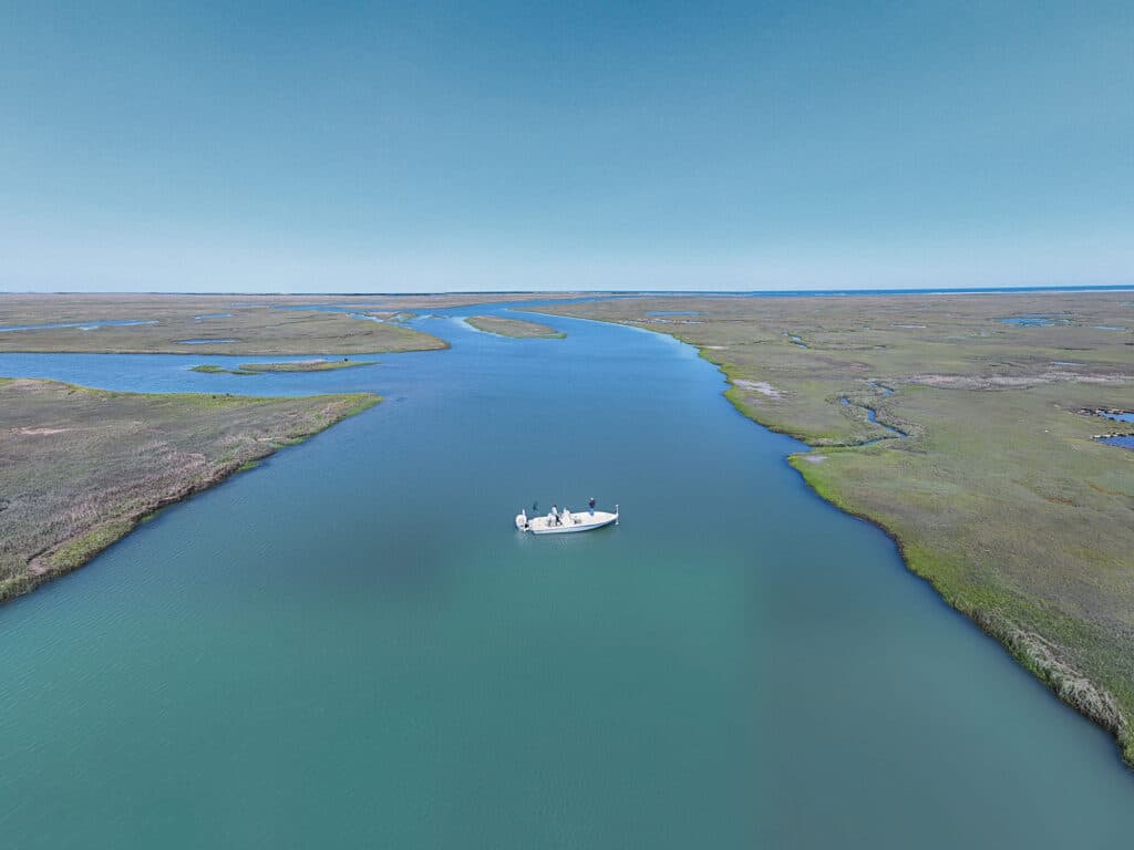 Anglers fishing in the marsh for striped bass