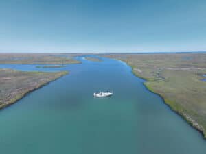 Anglers fishing in the marsh for striped bass