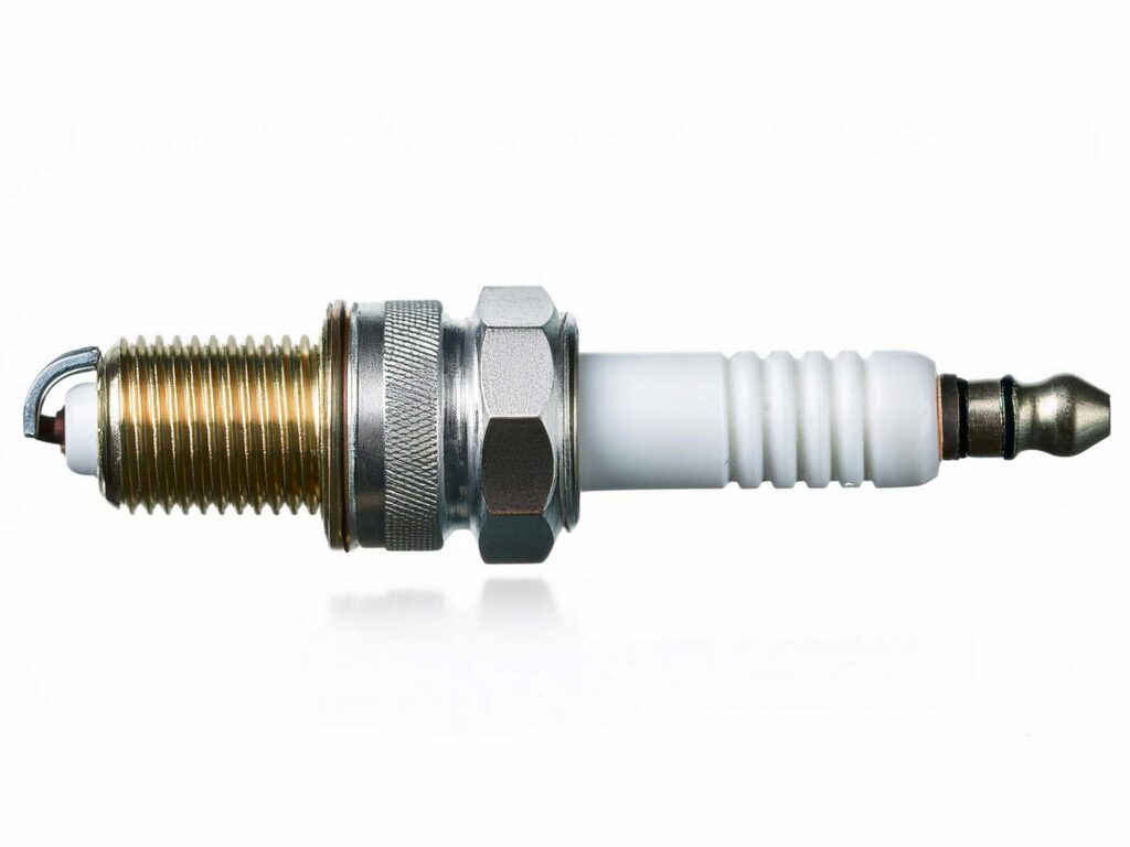 Spark plug for a boat engine