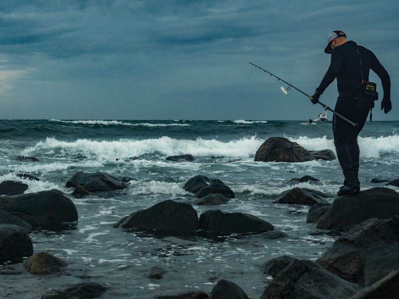 Angler walking on the rocks