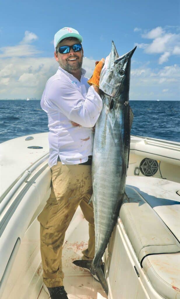 Large wahoo on a boat