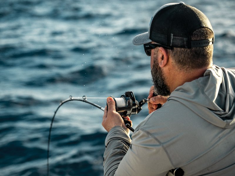 Angler with a fish on while jigging