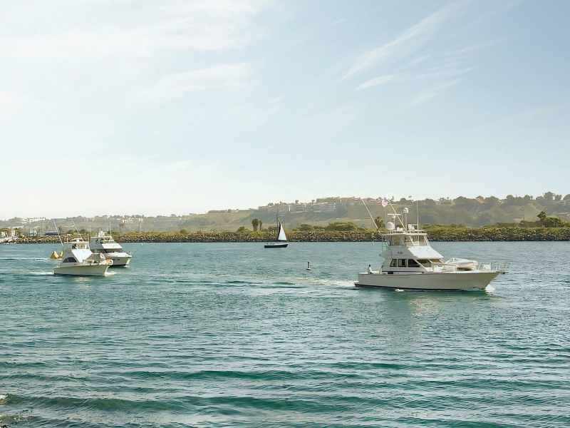 Boats heading out to fish for barred sand bass