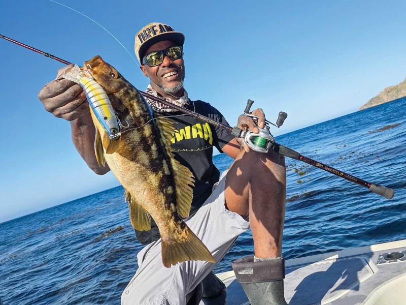 Angler holding up nice calico bass